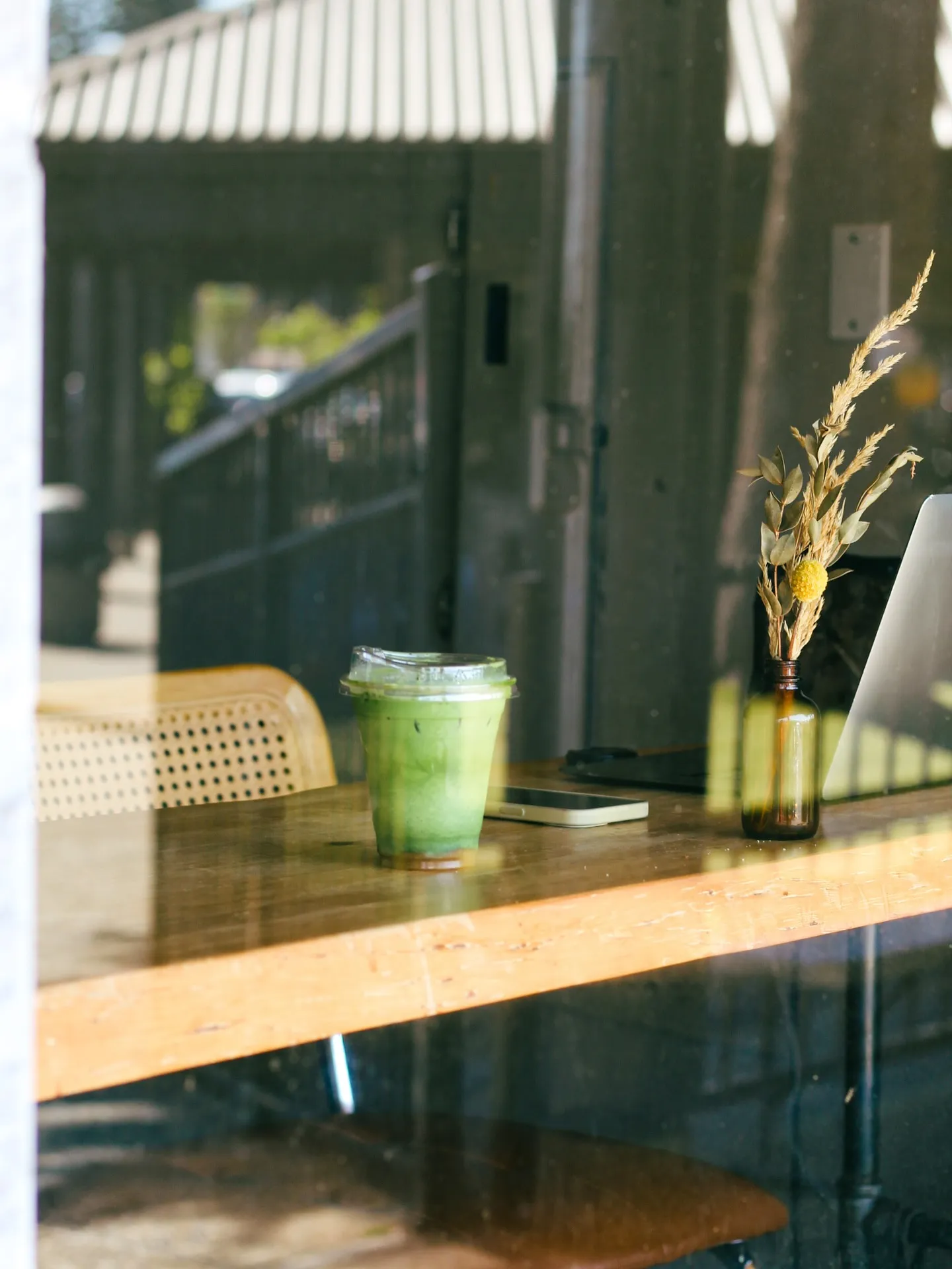 An iced matcha latte on a café table at Cafe Amarti